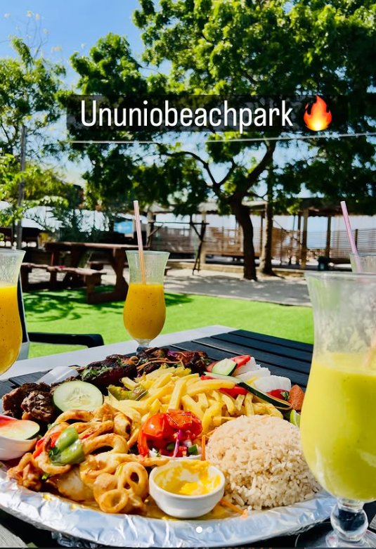 Fresh mango and avocado juices on a table on the Ununio lawn